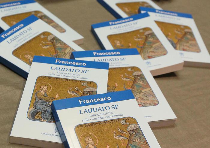 Copies of Pope Francis's encyclical, a collection of principles to guide Catholic teaching, entitled "Laudato Si " lies on a table during its official presentation at the Sinod hall in the Vatican, 18 June 2015. ANSA/ALESSANDRO DI MEO