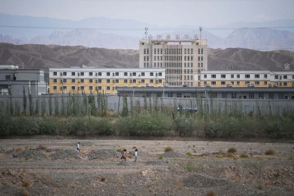 This photo taken on June 2, 2019 shows buildings at the Artux City Vocational Skills Education Training Service Center, believed to be a re-education camp where mostly Muslim ethnic minorities are detained, north of Kashgar in China's northwestern Xinjiang region. - As many as one million ethnic Uighurs and other mostly Muslim minorities are believed to be held in a network of internment camps in Xinjiang, but China has not given any figures and describes the facilities as Òvocational education centresÓ aimed at steering people away from extremism. (Photo by GREG BAKER / AFP) / TO GO WITH China-Xinjiang-media-rights-press,FOCUS by Eva XIAO        (Photo credit should read GREG BAKER/AFP via Getty Images)