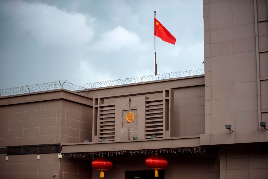 The Chinese flag flies at the Chinese consulate in Houston on July 22, 2020. - US-Chinese tensions, already rising because of the coronavirus pandemic and crackdown in Hong Kong, ratcheted up another notch on Wednesday as the US ordered the closure of the Chinese consulate in Houston within 72 hours. China reacted angrily to the US move, which came a day after the unveiling of a US indictment of two Chinese nationals for allegedly hacking hundreds of companies worldwide. (Photo by Mark Felix / AFP) (Photo by MARK FELIX/AFP /AFP via Getty Images)