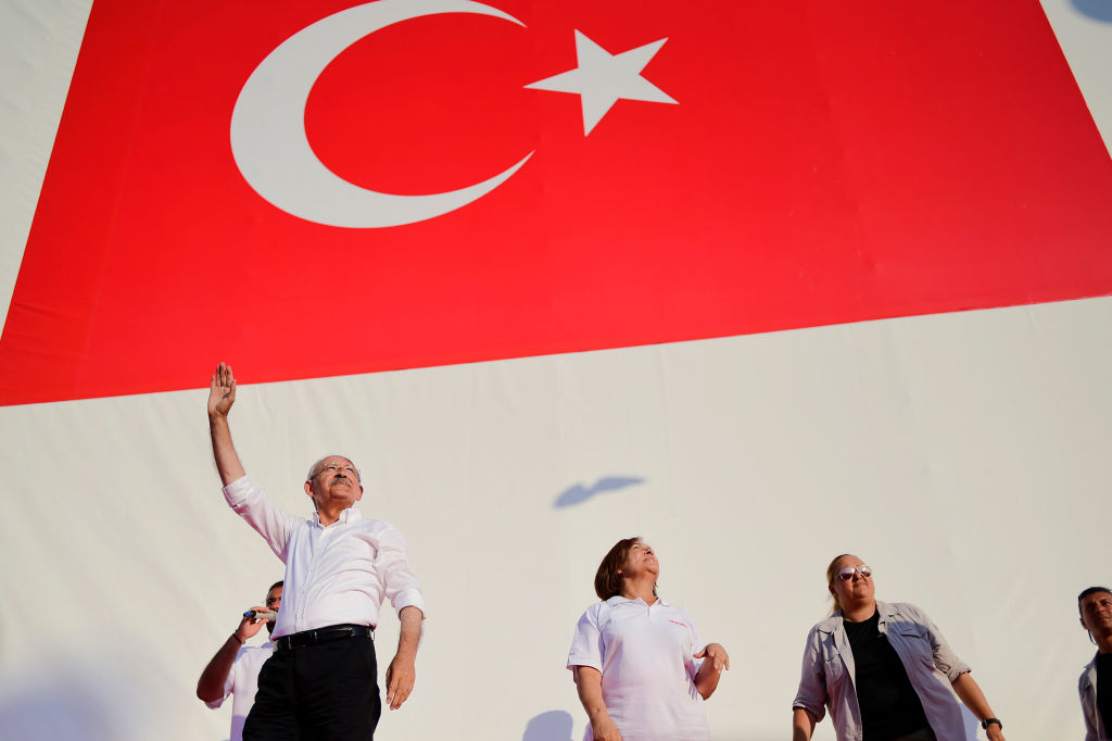 TOPSHOT - Turkey's main opposition Republican People's Party (CHP) leader Kemal Kilicdaroglu (L), waves to supporters as he arrives for a rally in the Maltepe district of Istanbul on July 9, 2017, marking the end of a 450-kilometre (280 miles) "justice march" from Ankara to Istanbul. - Hundreds of thousands of Turkish opposition supporters thronged an Istanbul square to mark the end of a nearly month-long march protesting alleged injustices under President Recep Tayyip Erdogan, in a rare challenge to him. (Photo by Yasin AKGUL / AFP) (Photo by YASIN AKGUL/AFP via Getty Images)