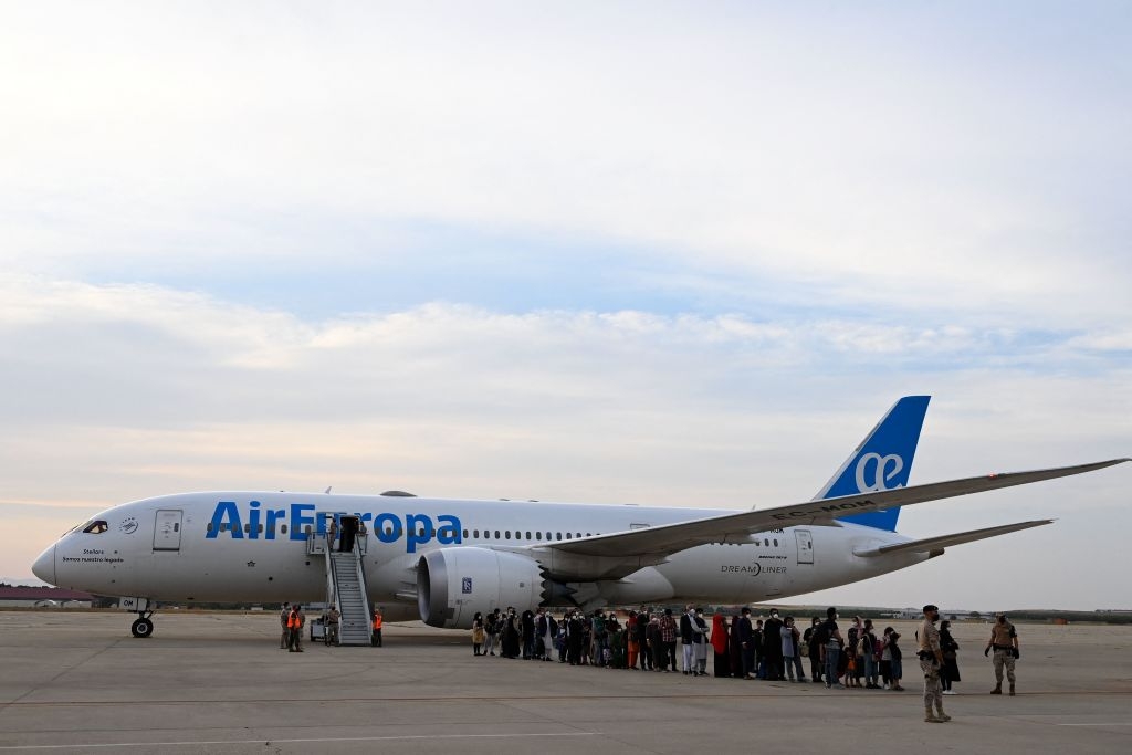 Refugees disembark from an evacuation flight from Kabul, at the Torrejon de Ardoz air base, 30 km from Madrid, on August 24, 2021. - Spain has been evacuating its nationals and local contractors from Afghanistan via Dubai since the Taliban swept to power ten days ago. Another 420 people are expected to arrive in Spain on August 24, 2021, including 290 people from Dubai and 130 who are expected to leave on a Spanish military plane from Kabul. (Photo by PIERRE-PHILIPPE MARCOU / AFP) (Photo by PIERRE-PHILIPPE MARCOU/AFP via Getty Images)