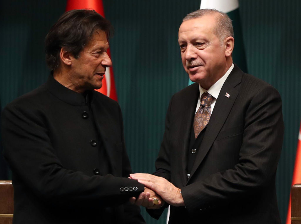 Turkish President Recep Tayyip Erdogan (R) and Pakistani Prime Minister Imran Khan (L) shake hands after a joint press conference at the Presidential Complex in Ankara, on January 4, 2019. (Photo by ADEM ALTAN / AFP)        (Photo credit should read ADEM ALTAN/AFP via Getty Images)