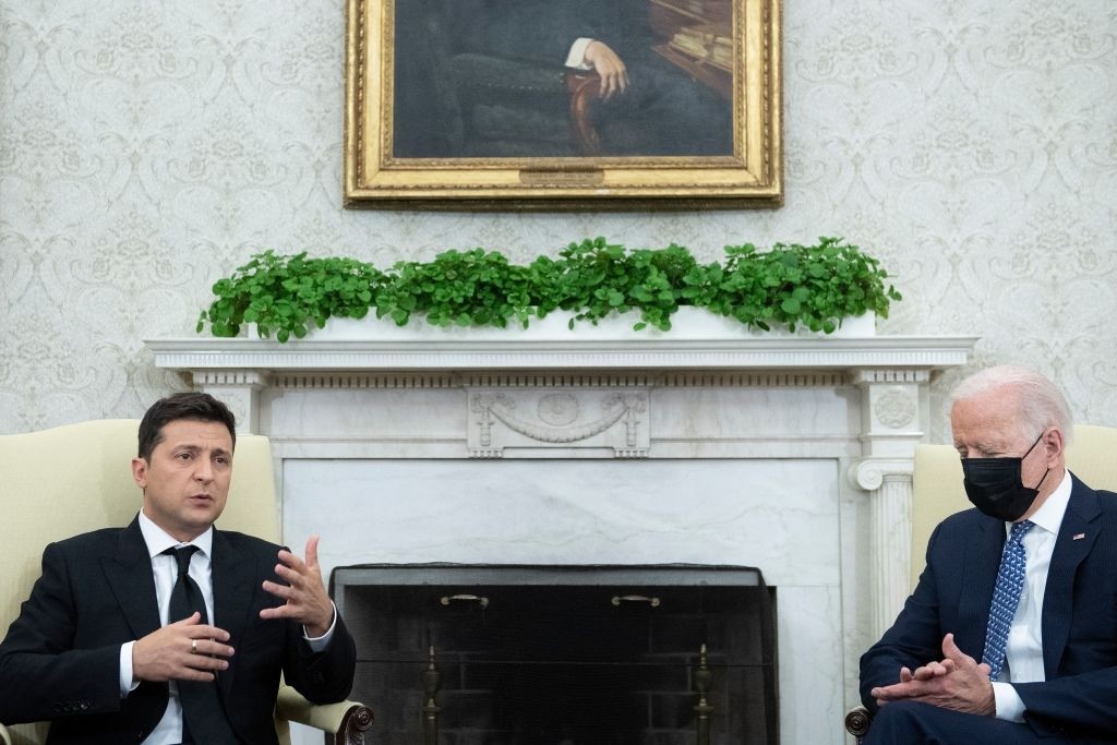 US President Joe Biden listens while Ukraine's President Volodymyr Zelensky speaks to the press before a meeting in the Oval Office of the White House September 1, 2021, in Washington, DC. - Ukraine's President Volodymyr Zelensky is only the second European leader to meet President Joe Biden at the White House on Wednesday but his bid for more heavyweight US protection against a powerful Russia is likely to be frustrated. (Photo by Brendan Smialowski / AFP) (Photo by BRENDAN SMIALOWSKI/AFP via Getty Images)