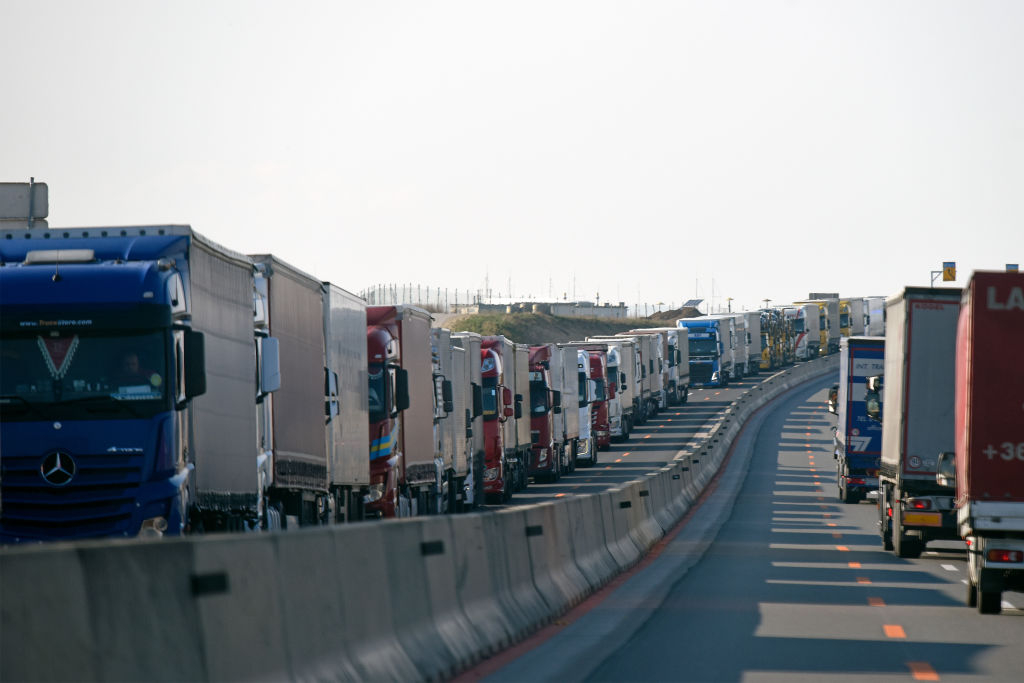 NICKELSDORF, AUSTRIA - MARCH 18: Trucks are parked on the motorway leading to the Austrian-Hungarian border crossing near Nickelsdorf on March 18, 2020 in Nickelsdorf, Austria. After negotiations between Austrian and Hungarian authorities, Hungary opened the border for Rumanian, Serbian and Bulgarian citizens. Prior to the measures the queues on Austrian side were up to 60kms long. (Photo by Thomas Kronsteiner/Getty Images)