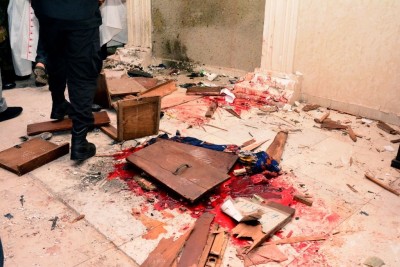 EDITORS NOTE: Graphic content / A man walk past the blood the stained floor after an attack by gunmen at St. Francis Catholic Church in Owo town, southwest Nigeria on June 5, 2022. - Gunmen with explosives stormed a Catholic church and opened fire in southwest Nigeria on June 5, killing "many" worshippers and wounding others, the government and police said. The violence at St. Francis Catholic Church in Owo town in Ondo State erupted during the morning service in a rare attack in the southwest of Nigeria, where jihadists and criminal gangs operate in other regions. (Photo by AFP) (Photo by -/AFP via Getty Images)