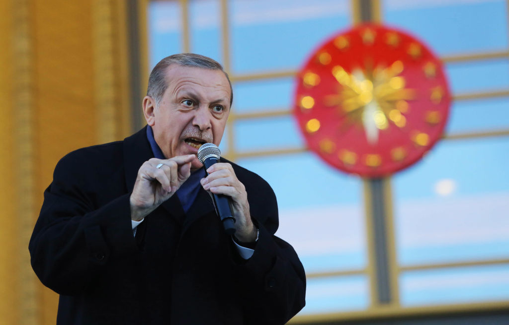 ANKARA, TURKEY - APRIL 17: Turkish President Tayyip Erdogan gives a referendum victory speech to his supporters at the Presidential Palace on April 17, 2017 in Ankara Turkey. Erdogan declared victory in Sunday's historic referendum that will grant sweeping powers to the presidency, hailing the result as a "historic decision. 51.4 per cent per cent of voters had sided with the "Yes" campaign, ushering in the most radical change to the country's political system in modern times.Turkey's main opposition calls on top election board to annul the referendum. OSCE observers said that a Turkish electoral board decision to allow as valid ballots that did not bear official stamps undermined important safeguards against fraud. (Photo by Elif Sogut/Getty Images)