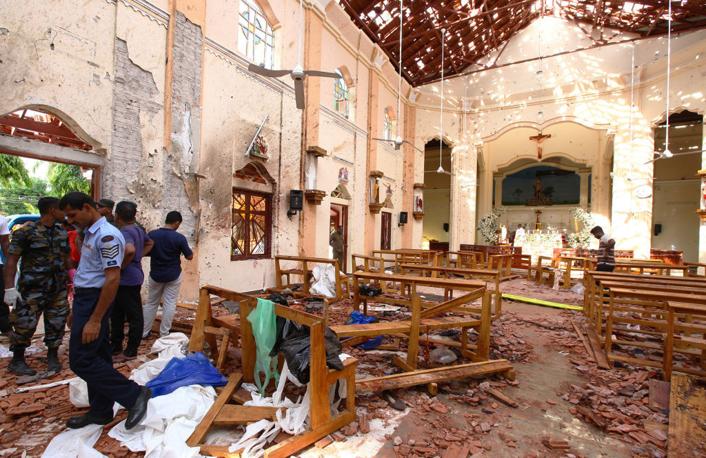 NEGOMBO, SRI LANKA - APRIL 21: Sri Lankan officials inspect St. Sebastian's Church in Negombo, north of Colombo, after multiple explosions targeting churches and hotels across Sri Lanka on April 21, 2019, in Negombo, Sri Lanka. At least 207 people have been killed and hundreds more injured after multiple explosions rocked three churches and three luxury hotels in and around Colombo as well as at Batticaloa in Sri Lanka during Easter Sunday mass. According to reports, at least 400 people were injured and are undergoing treatment as the blasts took place at churches in Colombo city as well as neighboring towns and hotels, including the Shangri-La, Kingsbury and Cinnamon Grand, during the worst violence in Sri Lanka since the civil war ended a decade ago. Christians worldwide celebrated Easter on Sunday, commemorating the day on which Jesus Christ is believed to have risen from the dead. (Photo by Stringer/Getty Images)