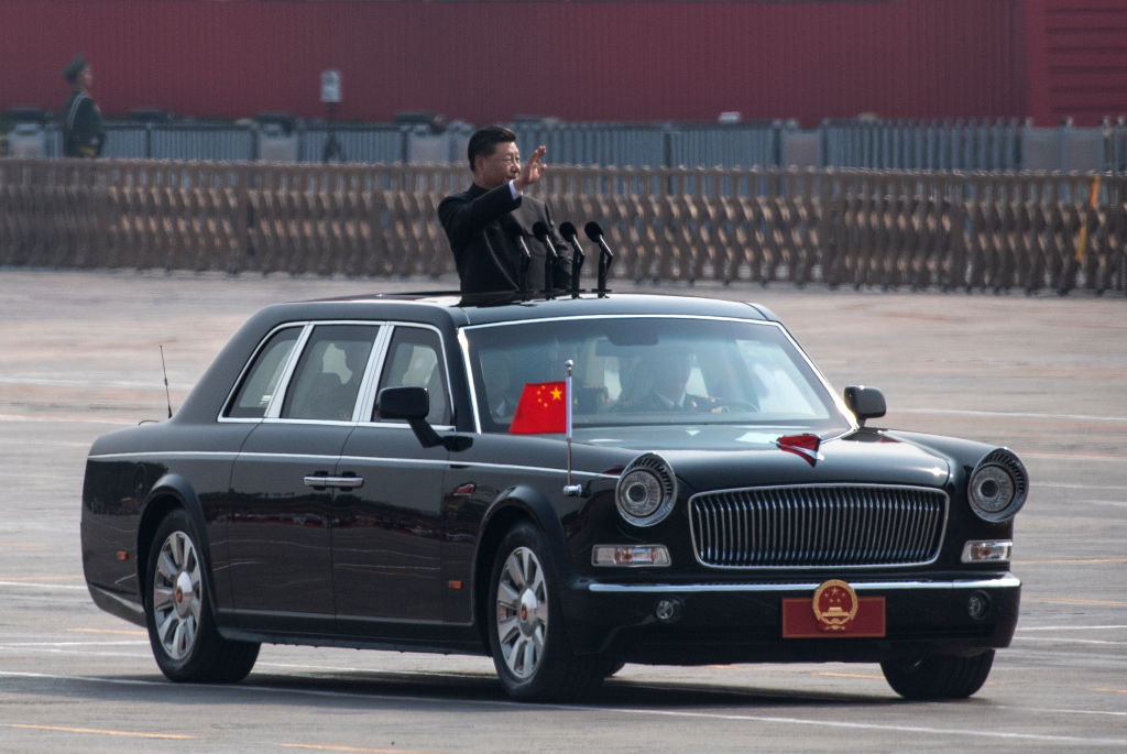 BEIJING, CHINA - OCTOBER 01: Chinese President Xi Jinping waves as he drives after inspecting the troops during a parade to celebrate the 70th Anniversary of the founding of the People's Republic of China at Tiananmen Square in 1949, on October 1, 2019 in Beijing, China. (Photo by Kevin Frayer/Getty Images)