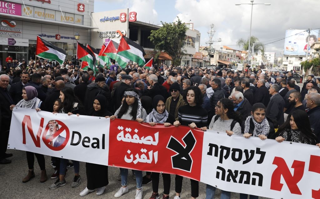 Arab Israelis take part in a rally to express their opposition to the US-brokered proposal for a settlement of the Middle East conflict, in the Arab-Israeli town of Baqa al-Gharbiya in northern Israel on February 1, 2020. - President Donald Trump's long delayed Middle East peace plan won support in Israel but was bitterly rejected by Palestinians facing possible Israeli annexation of key parts of the West Bank. (Photo by Ahmad GHARABLI / AFP) (Photo by AHMAD GHARABLI/AFP via Getty Images)