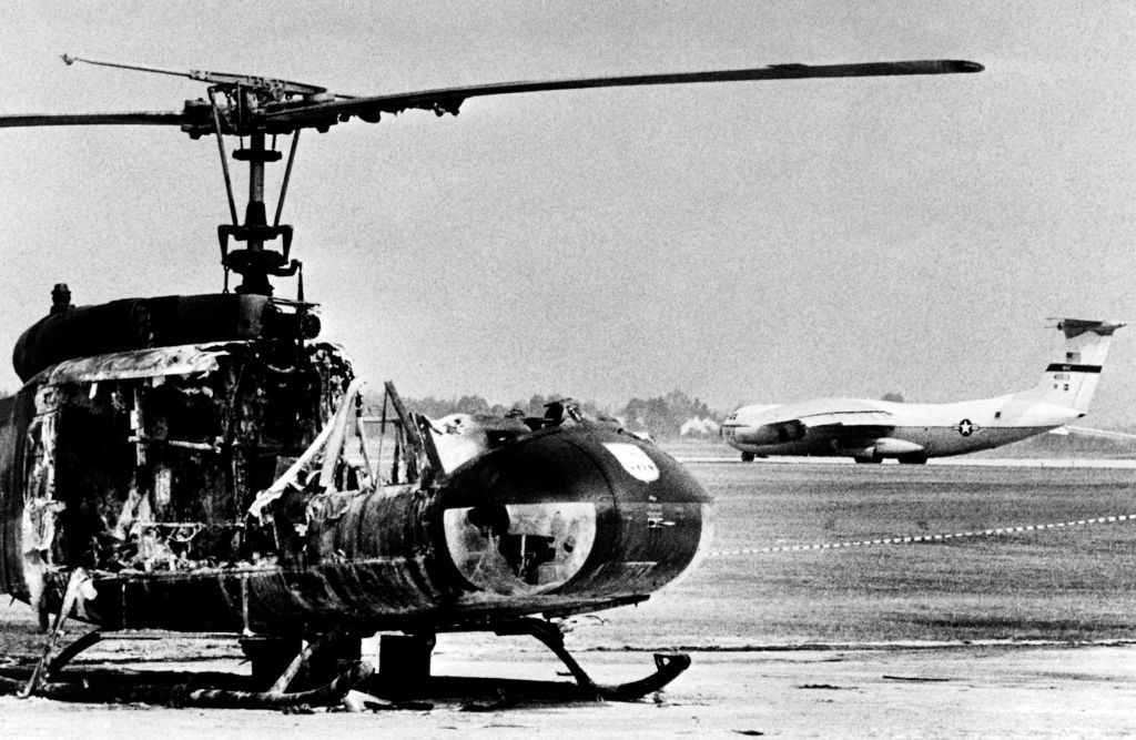 A burned-out army helicopter stands on Fürstenfeldbruck Air Base in Fürstenfeldbruck,  southern Germany, after Palestinian hostage-taking, on September 7, 1972. - Palestinian members of the "Black September" group had stormed the Israeli athletes quarters, during the Munich 1972 Olympic Games, killed two and took nine other members of the Israeli Olympic team hostages before a failed freeing action of the German police forces on the Fuerstenfeldbruck airport near Munich on September 6, leaving all hostages, five of the Palestinian kidnappers and a German policeman dead. (Photo by EPU / AFP) (Photo by -/EPU/AFP via Getty Images)