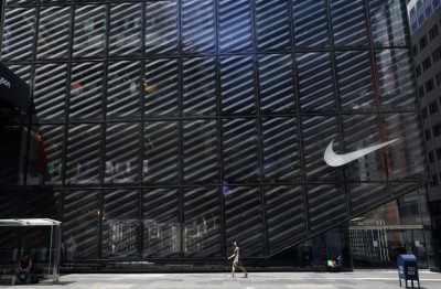 A man passes by the Nike store on Fifth Avenue as New York City enters  phase two of reopening June 22, 2020. - New York City begins Phase Two of the COVID-19 reopening as people can eat outdoors at restaurants, and barbershops and salons can also open at 50 percent capacity. (Photo by TIMOTHY A. CLARY / AFP) (Photo by TIMOTHY A. CLARY/AFP via Getty Images)