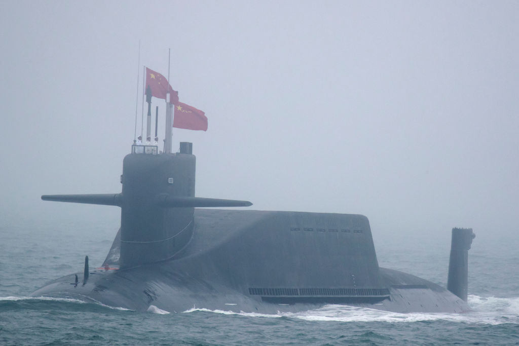 A new type 094A Jin-class nuclear submarine Long March 10 of the Chinese People's Liberation Army (PLA) Navy participates in a naval parade to commemorate the 70th anniversary of the founding of China's PLA Navy in the sea near Qingdao, in eastern China's Shandong province on April 23, 2019. - China celebrated the 70th anniversary of its navy by showing off its growing fleet in a sea parade featuring a brand new guided-missile destroyer. (Photo by Mark Schiefelbein / POOL / AFP)        (Photo credit should read MARK SCHIEFELBEIN/AFP via Getty Images)